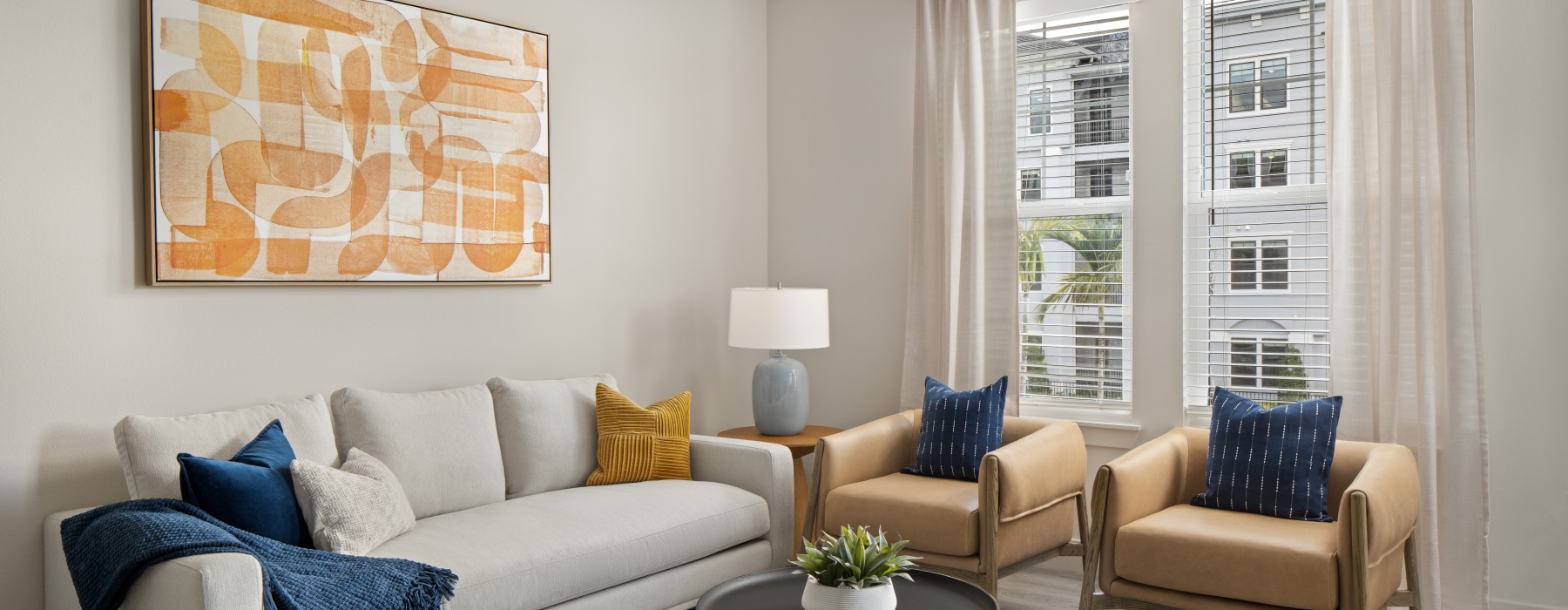 The essence of exceptional living a well lit living room with a couch and two chairs