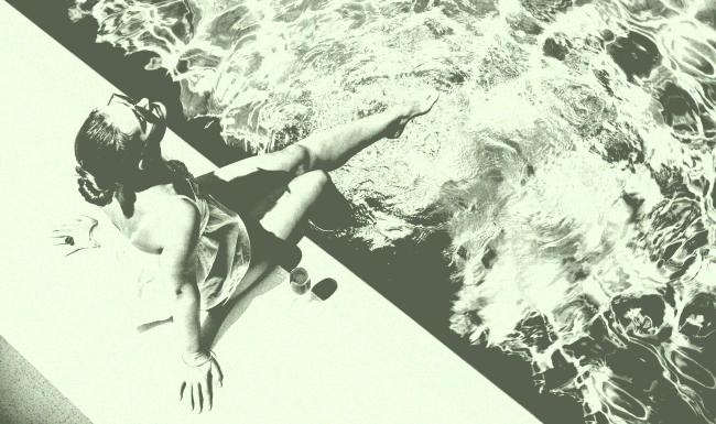 a person sitting by a pool